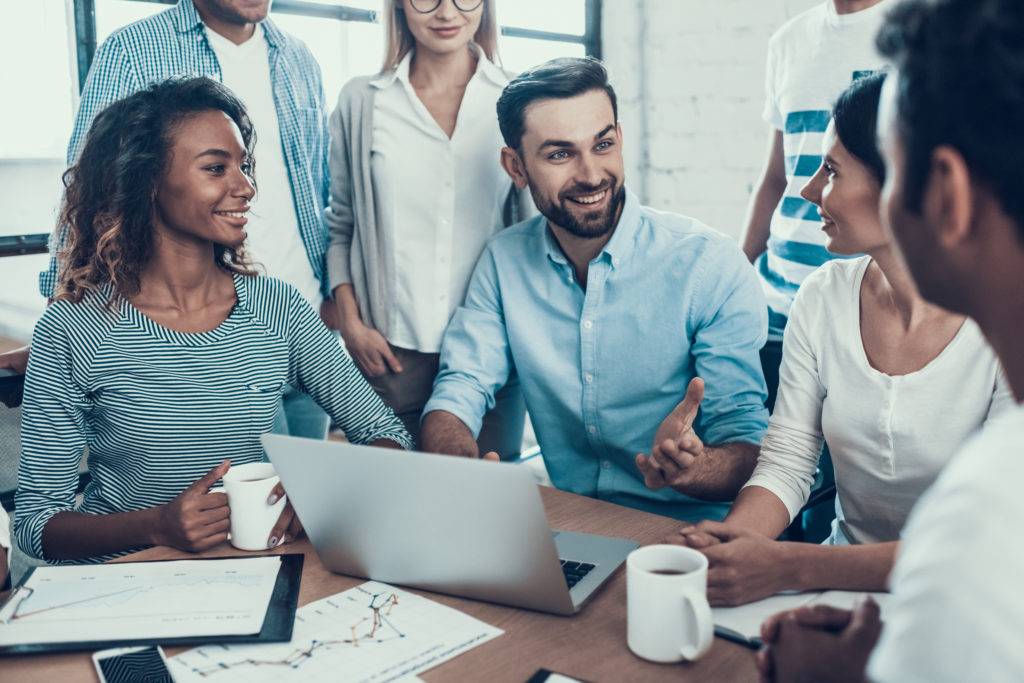 Happy business people working together in office