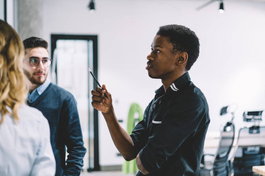 Young ceo developing business strategy during discussion